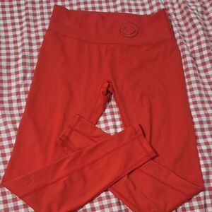 Red Leggings with Smiley Detail